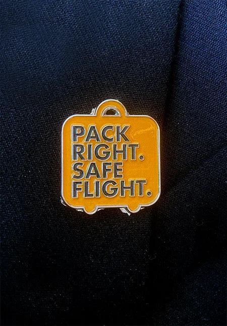 Pack Right. Safe Flight. lapel pin